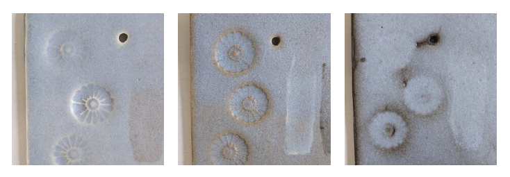 Three test tiles of white, brown, and black stoneware clay, glazed in matte pale blue