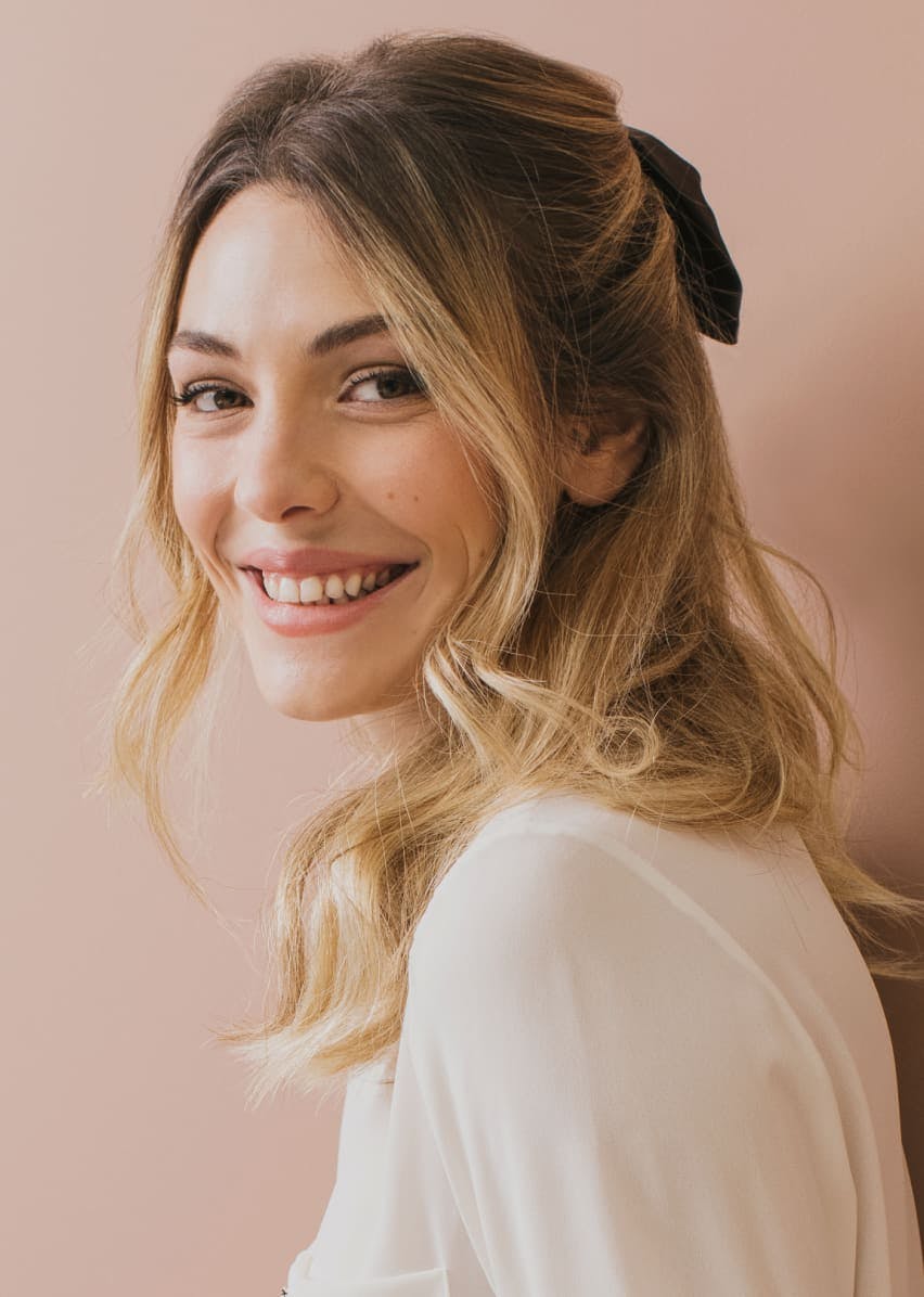 Woman smiling looking over her shoulder