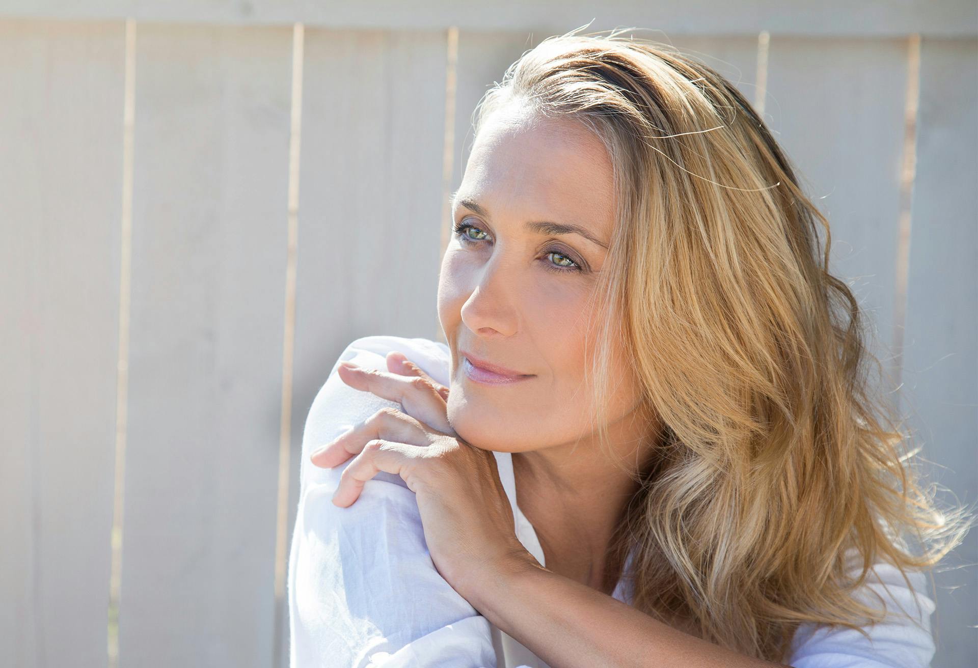 Woman smiling and looking to the side