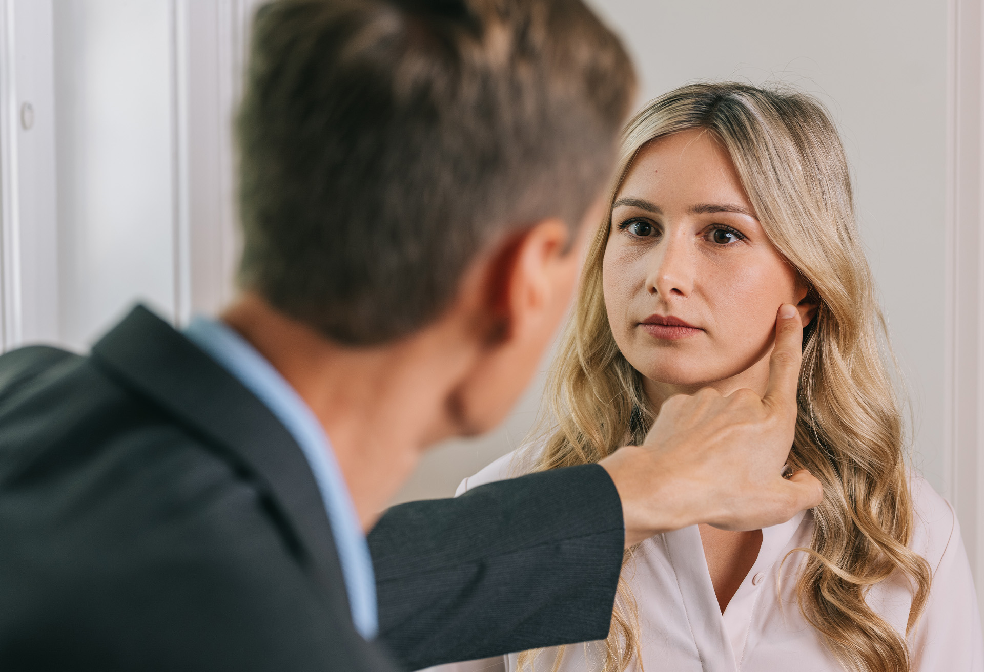Dr. Markelov working with a patient in his office.