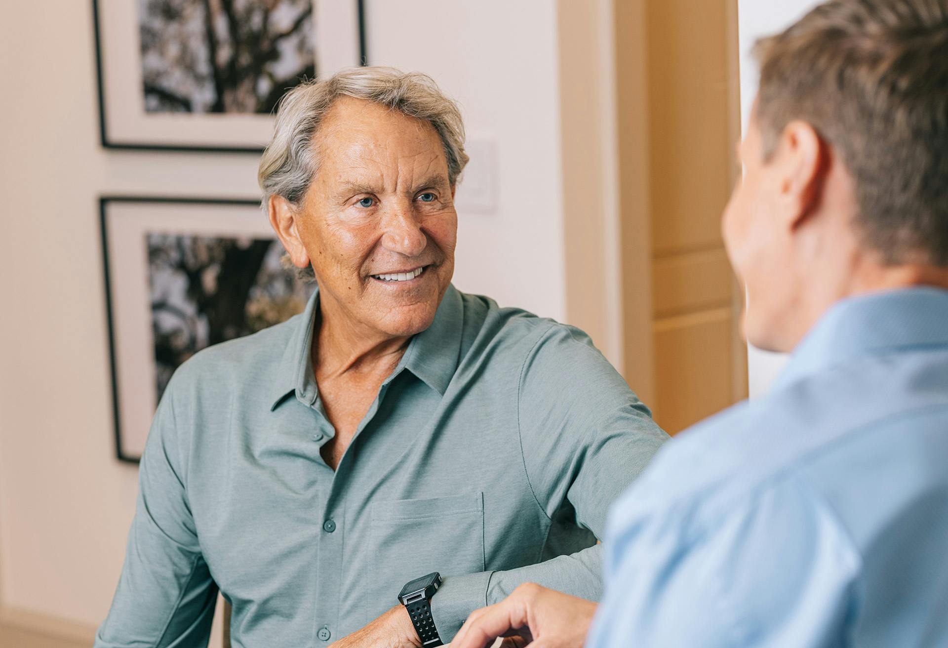 Dr. Markelov speaking with a male patient.