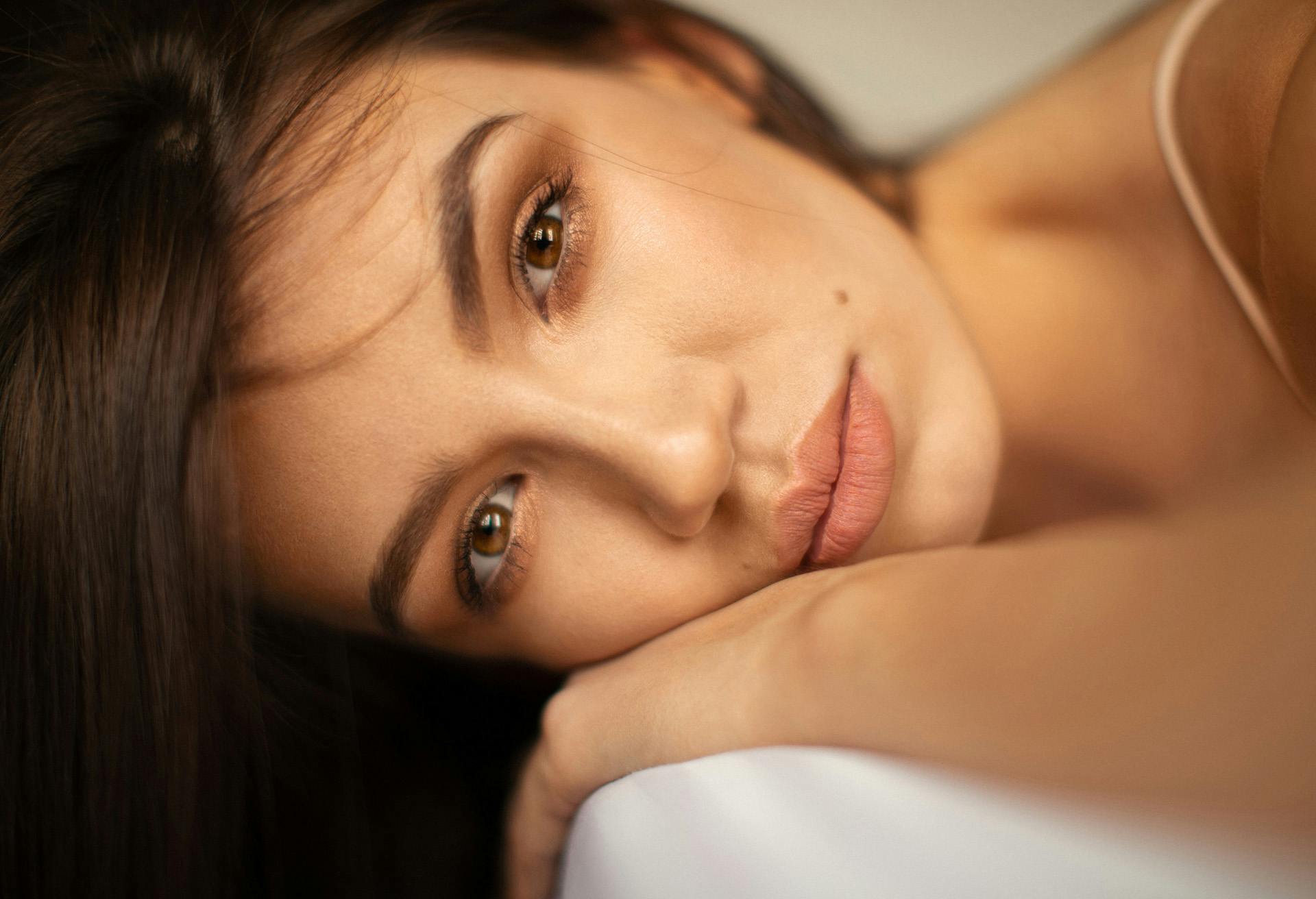 Woman posing lying on her side.