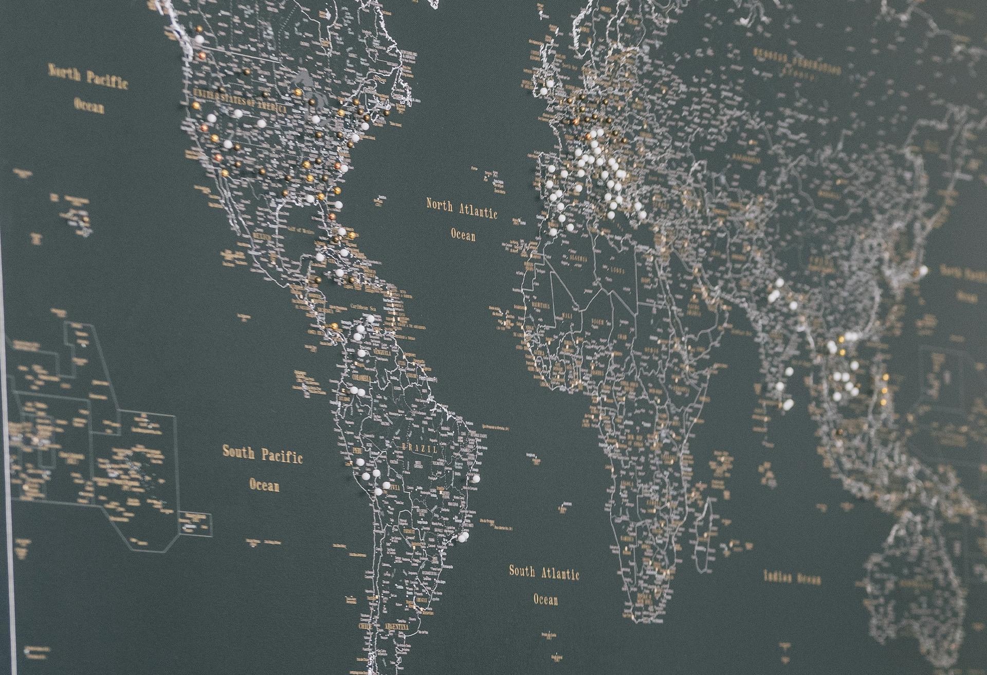 Earth map with pins on it