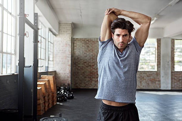Man doing an over arm stretch