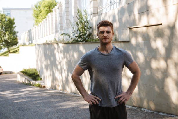 Fit male with hands on his hips