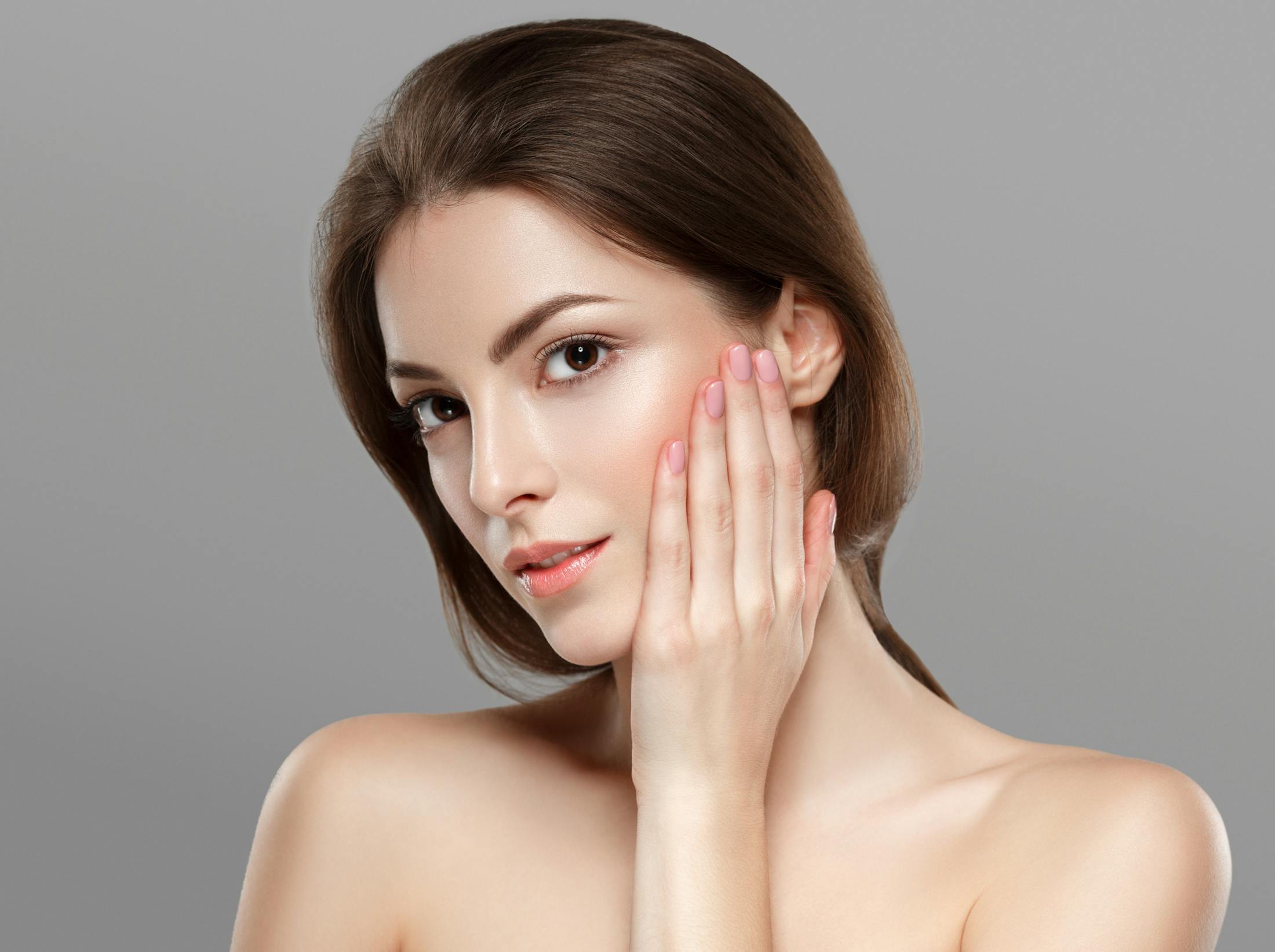 Woman touching her face