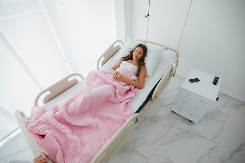 Woman lying in a recovery room