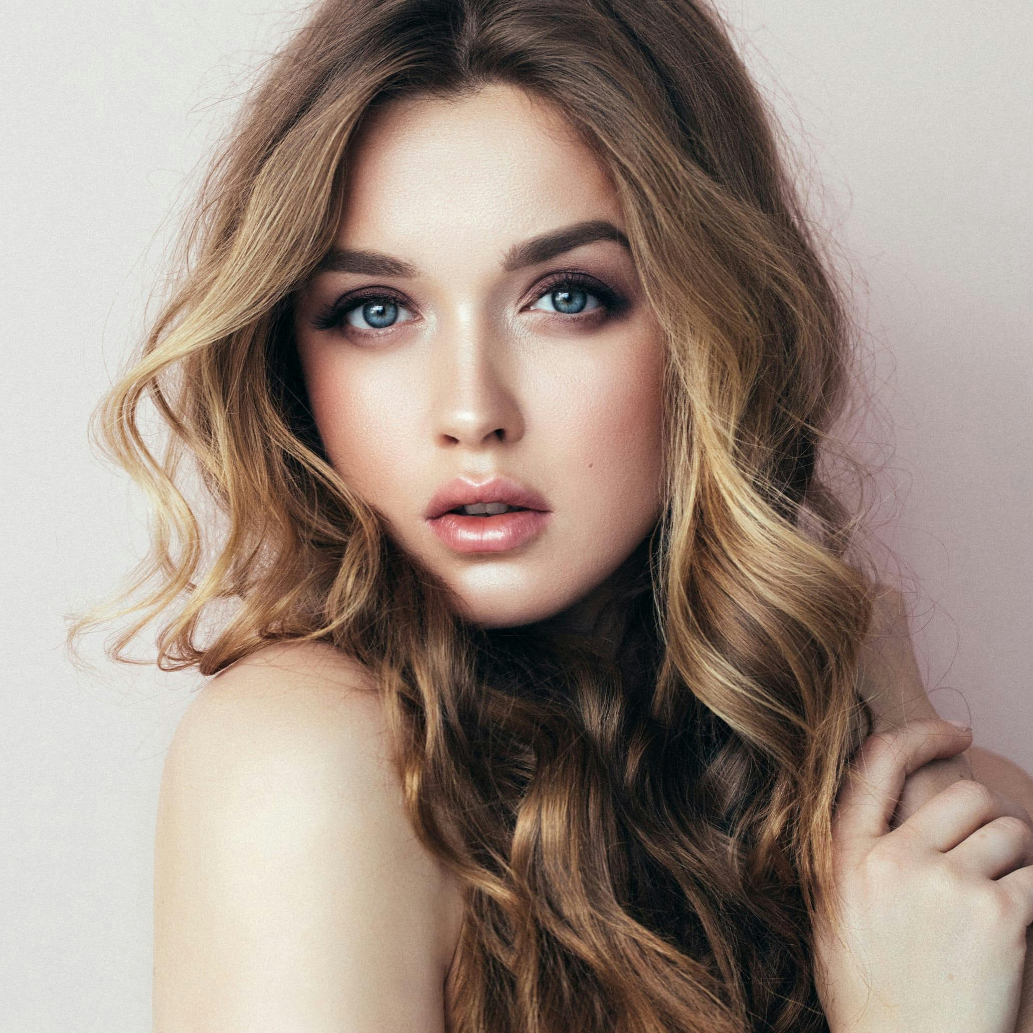 Woman with curly medium blonde hair
