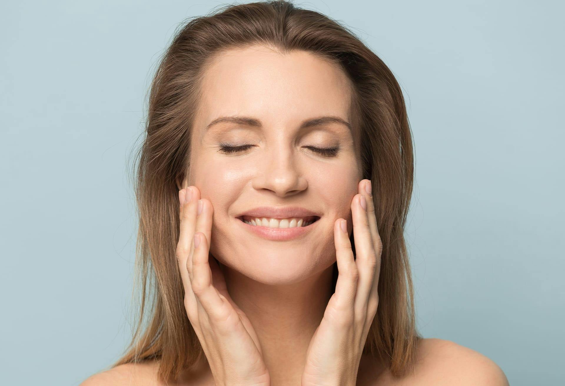 brunette woman with eyes closed