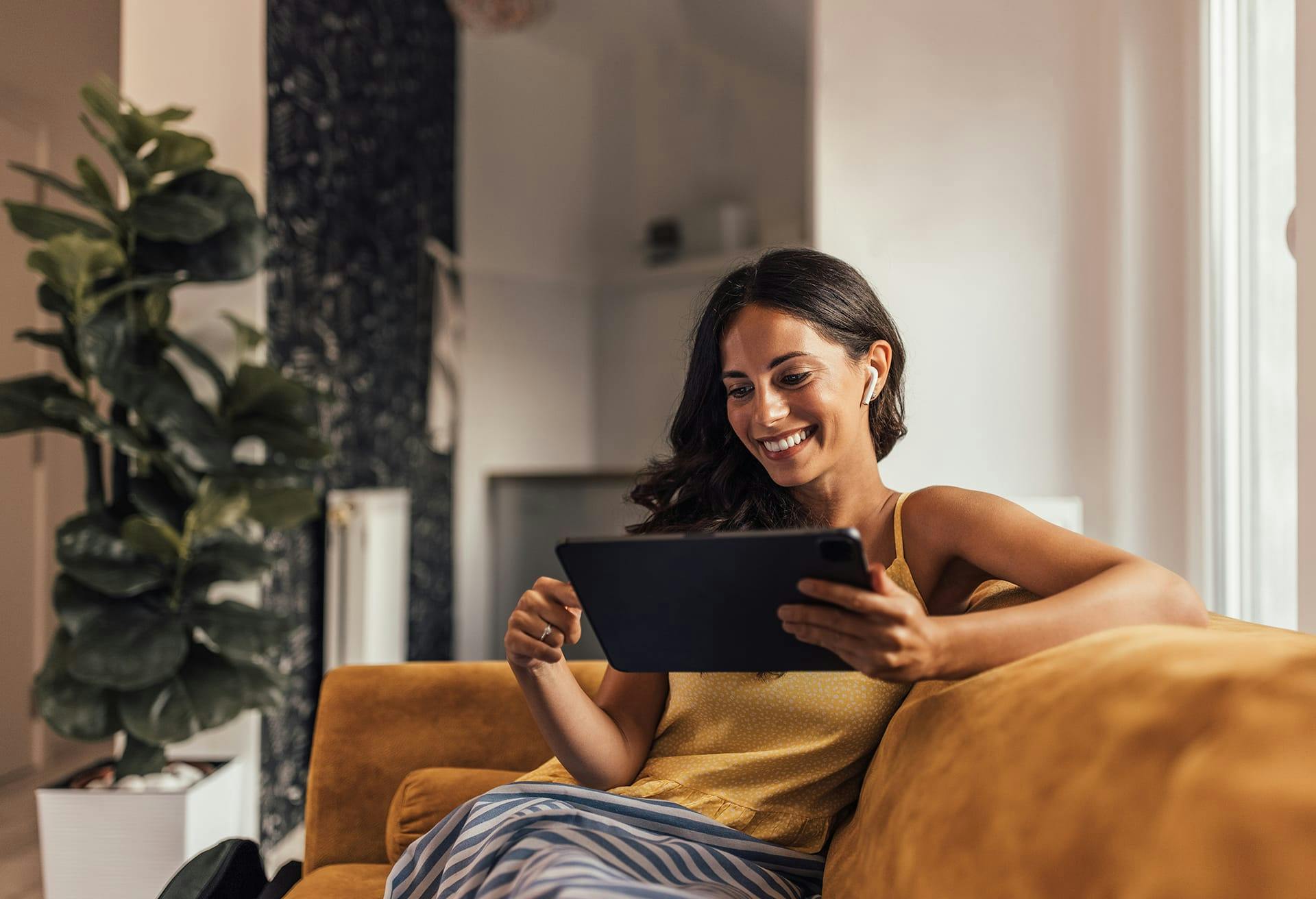 woman sitting with tablet