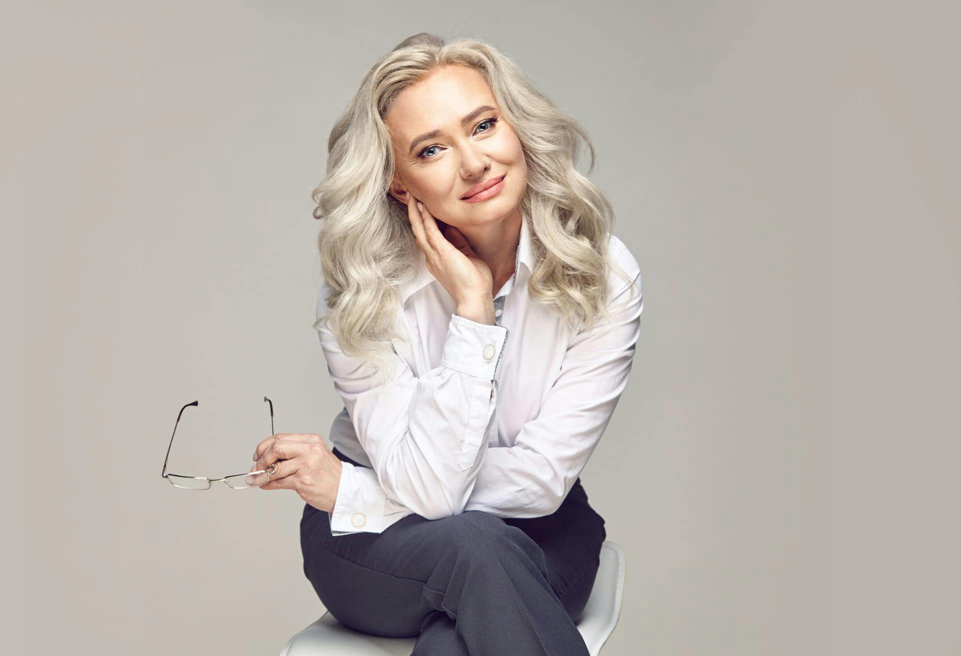 woman with white hair sitting