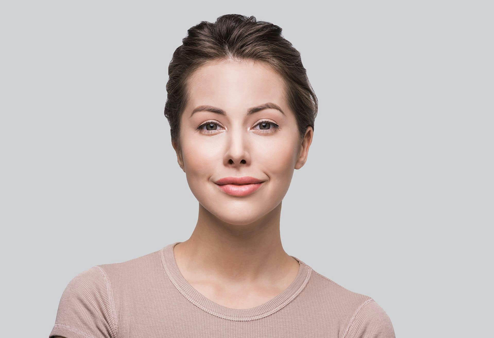 brunette womean with hair pulled back