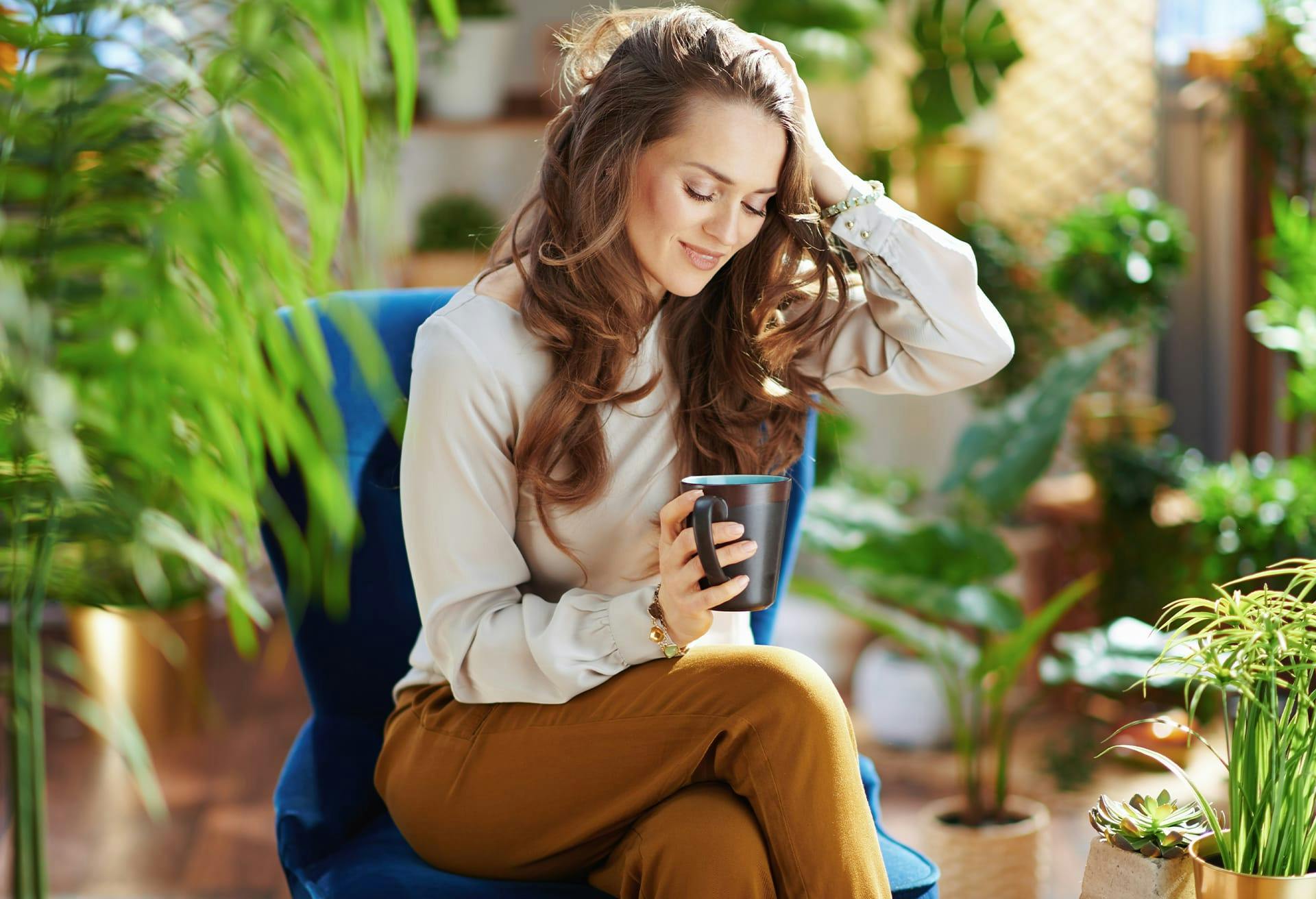 woman sitting in blue chair