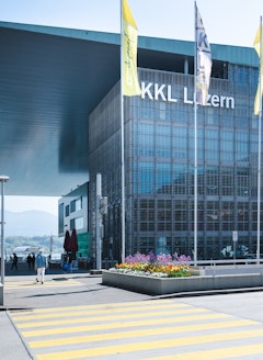 The KKL Lucerne from the Outside in Spring with Flags and Banners