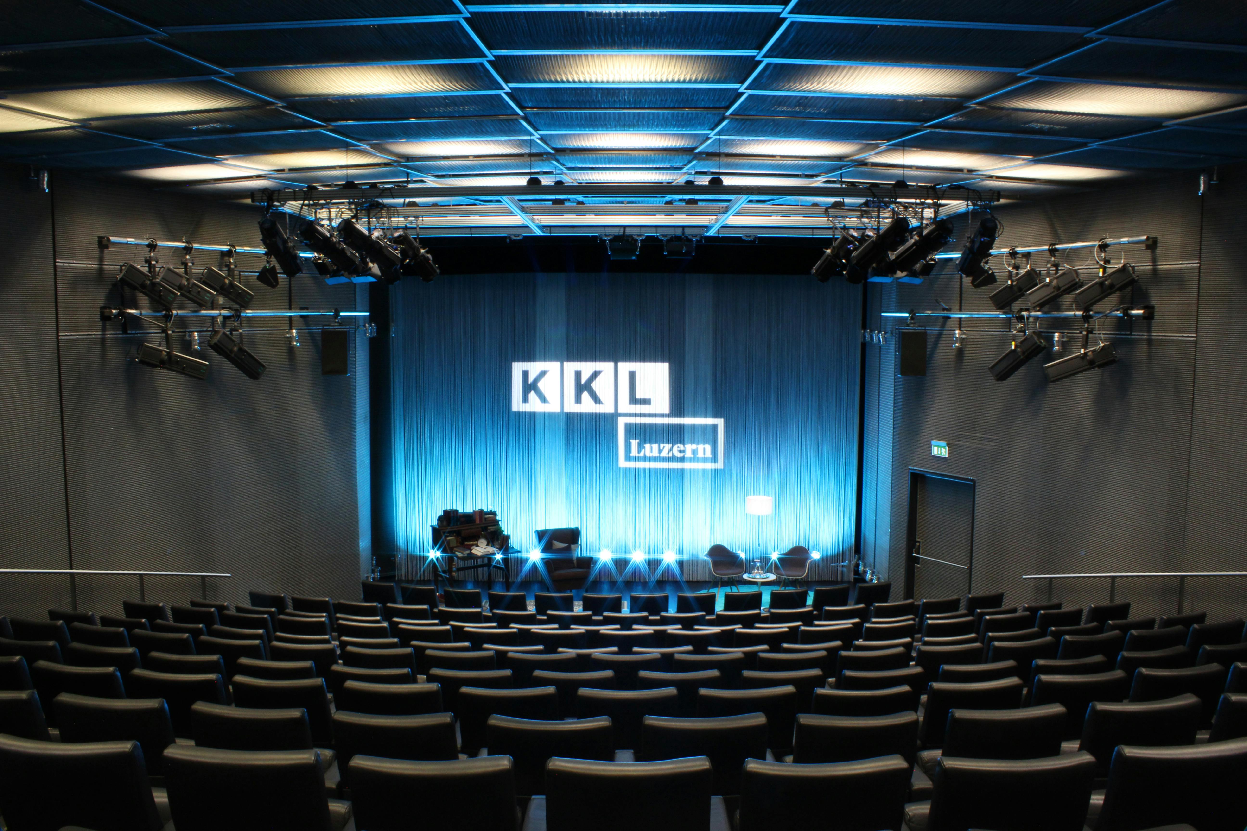 Auditorium in KKL Luzern with thread curtain and chairs for the reading