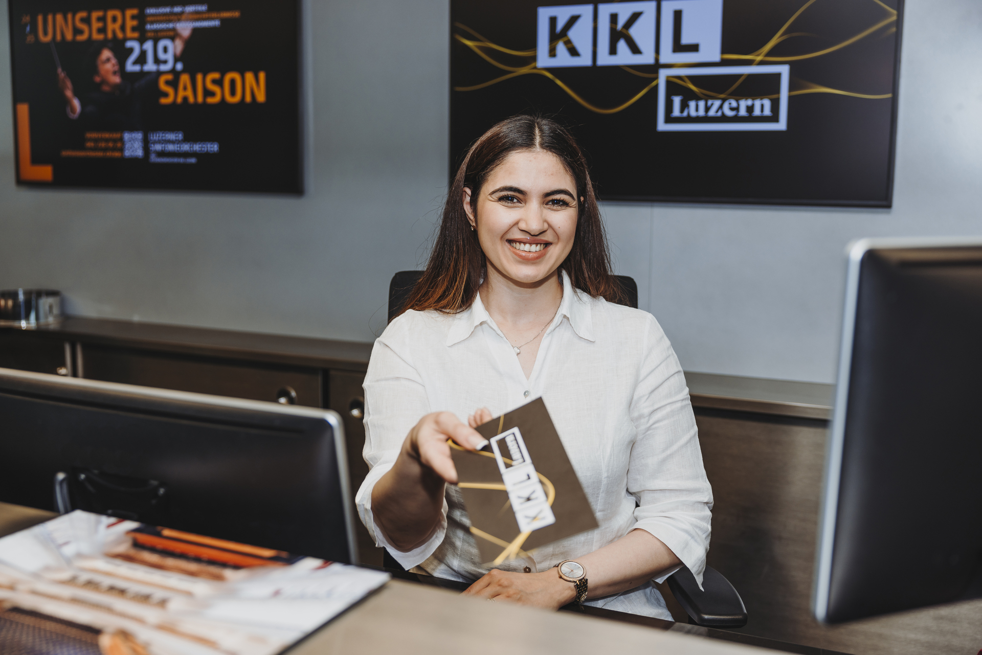 Ticketing employee, at the ticket counter at KKL Luzern