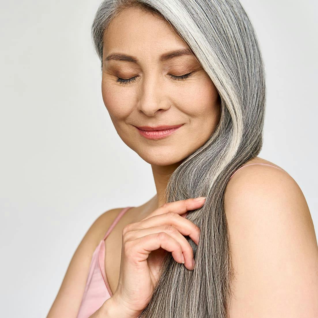 woman with gray long hair smiling