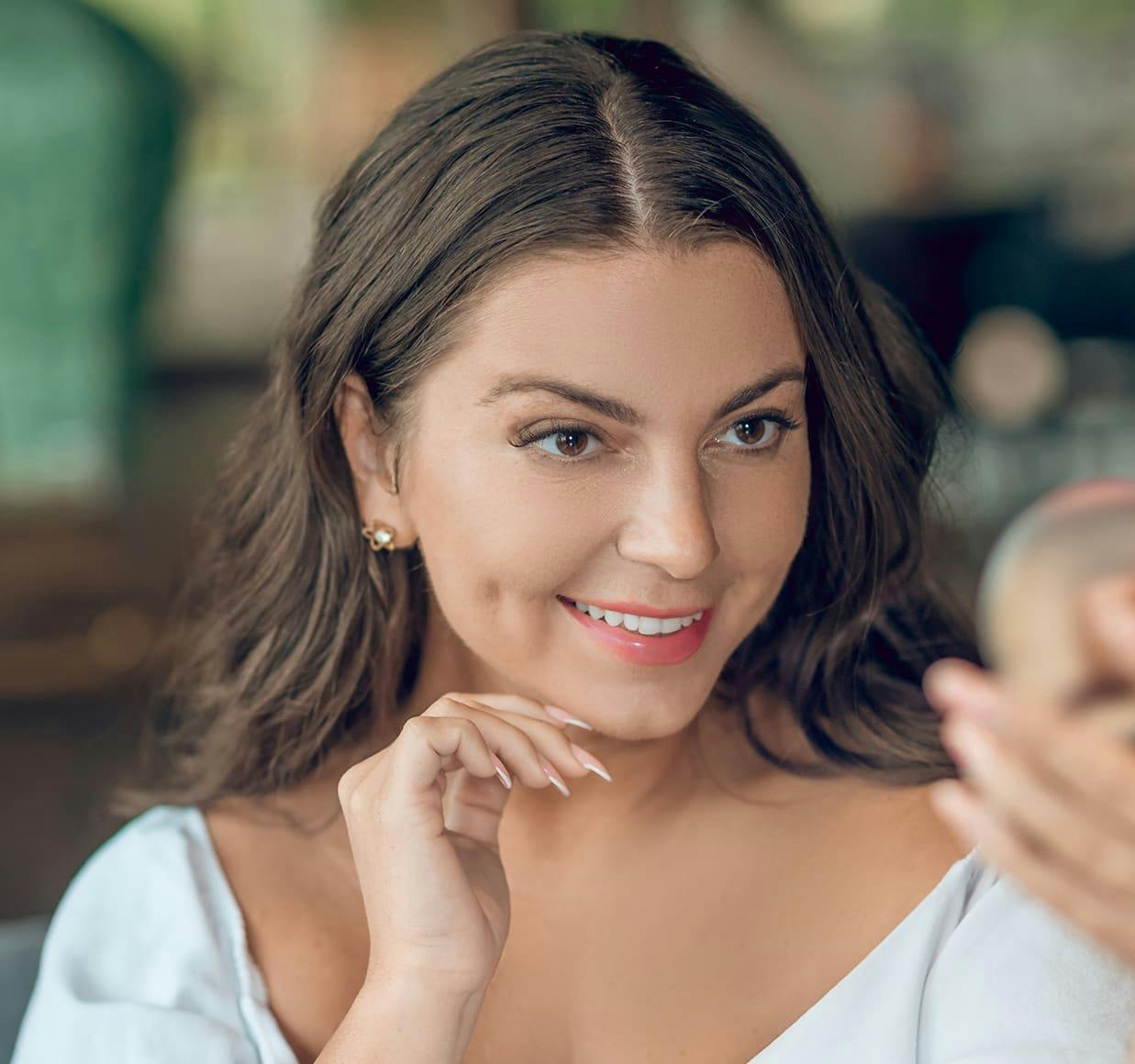 there is a woman that is looking at her cell phone