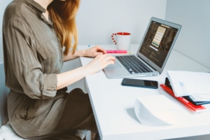 woman at a desk with a laptop on it