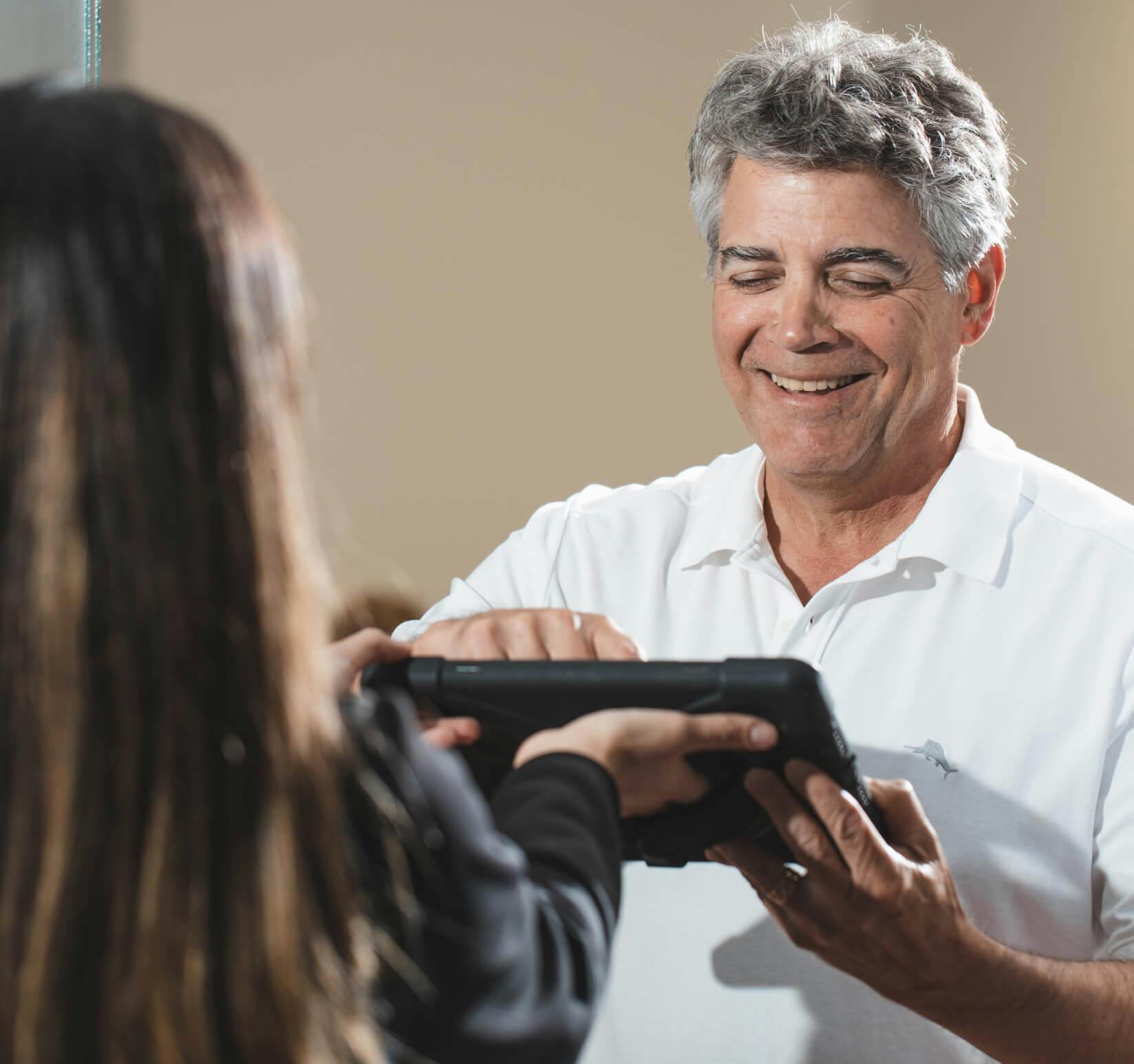 there is a man that is holding a video game controller