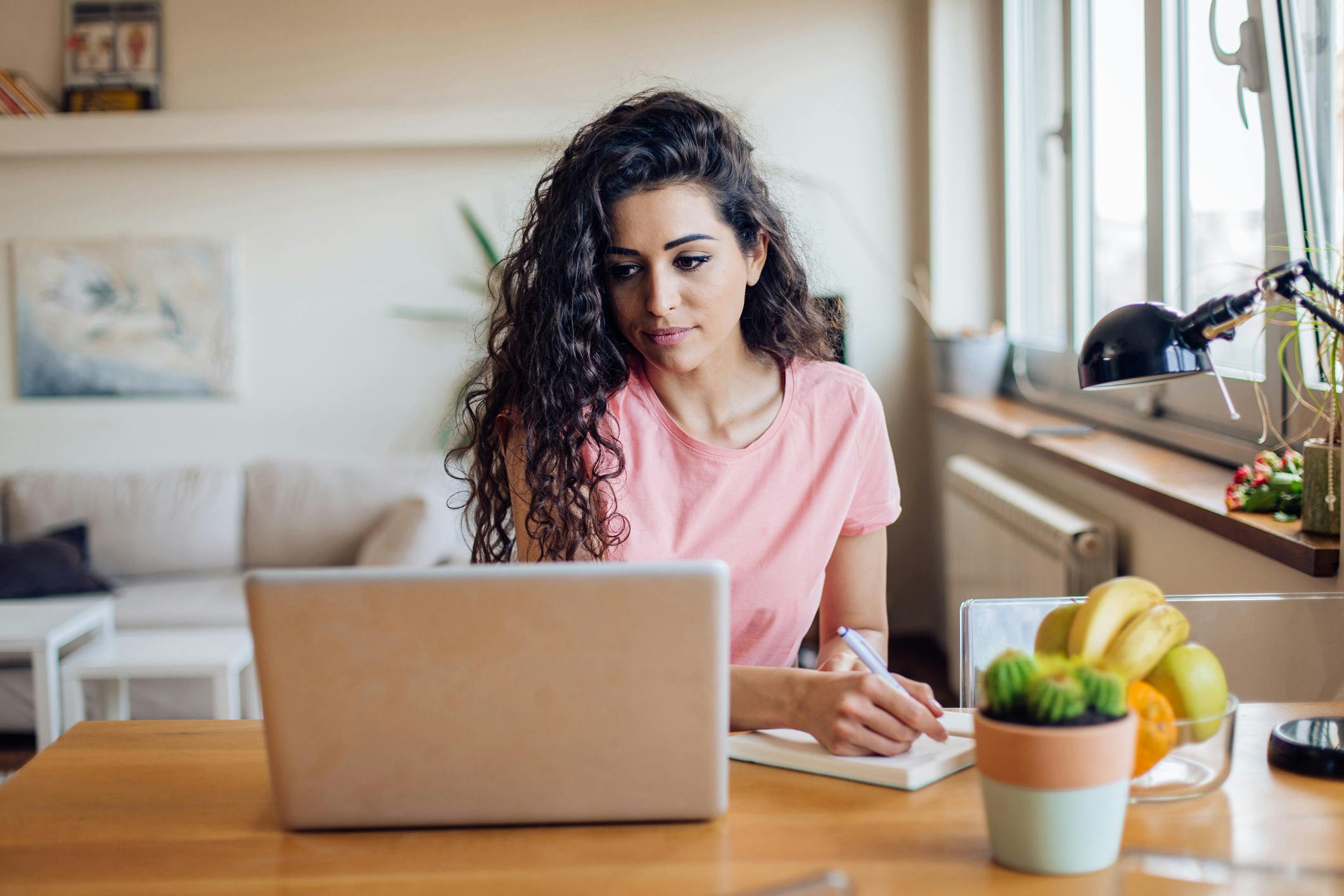 woman sitting in front of a laptop