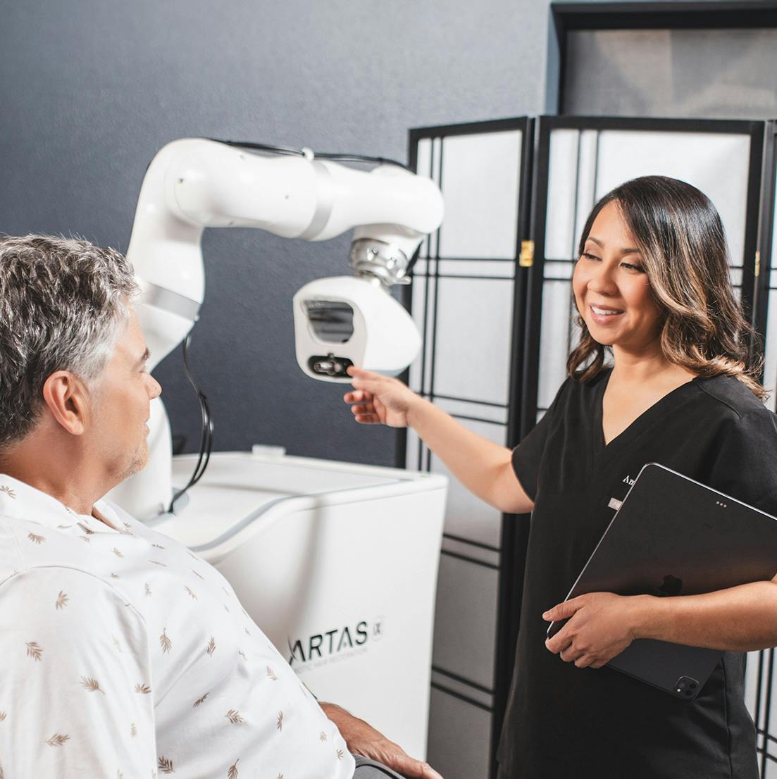 Dr. Shah talking to a patient
