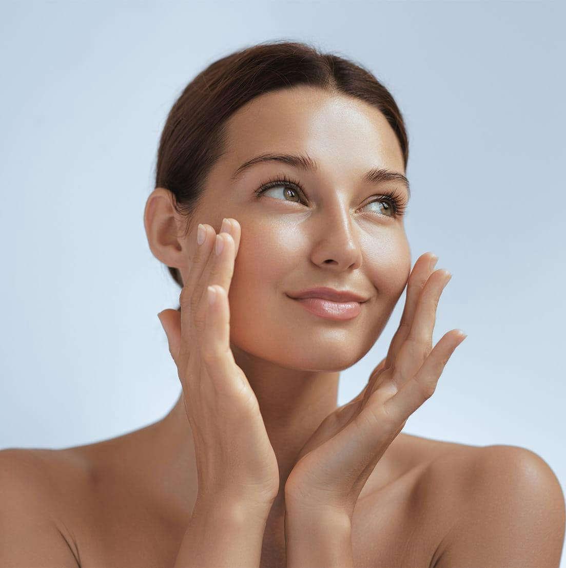 woman touching her face