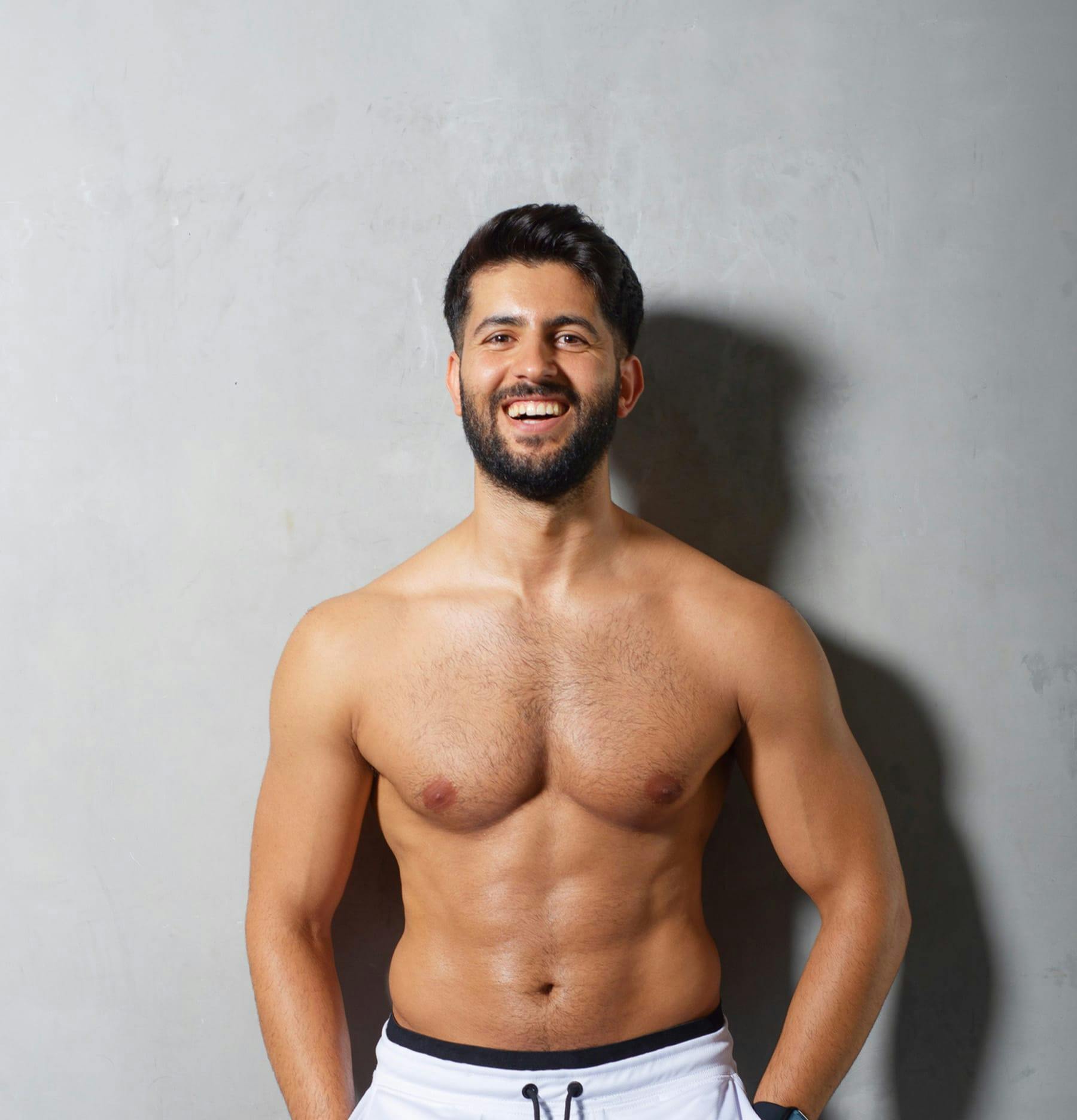 Shirtless man smiling