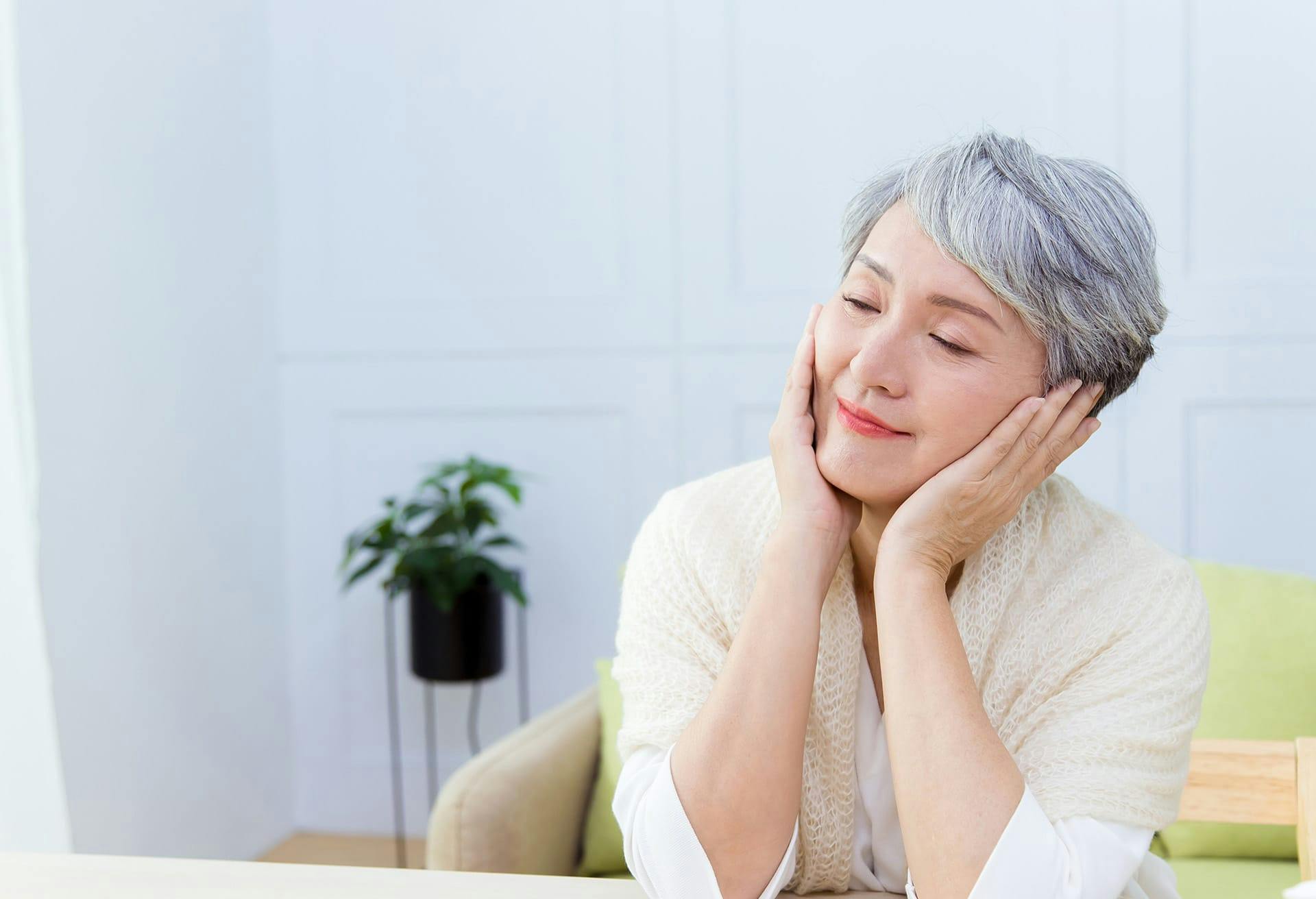 Woman with Her Hands on Her Face