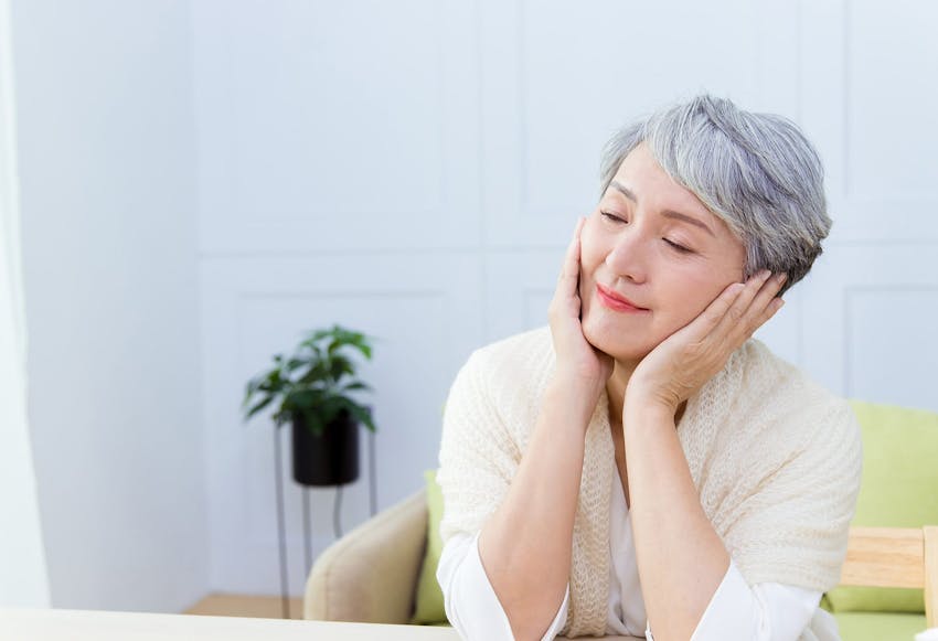 Woman with Her Hands on Her Face