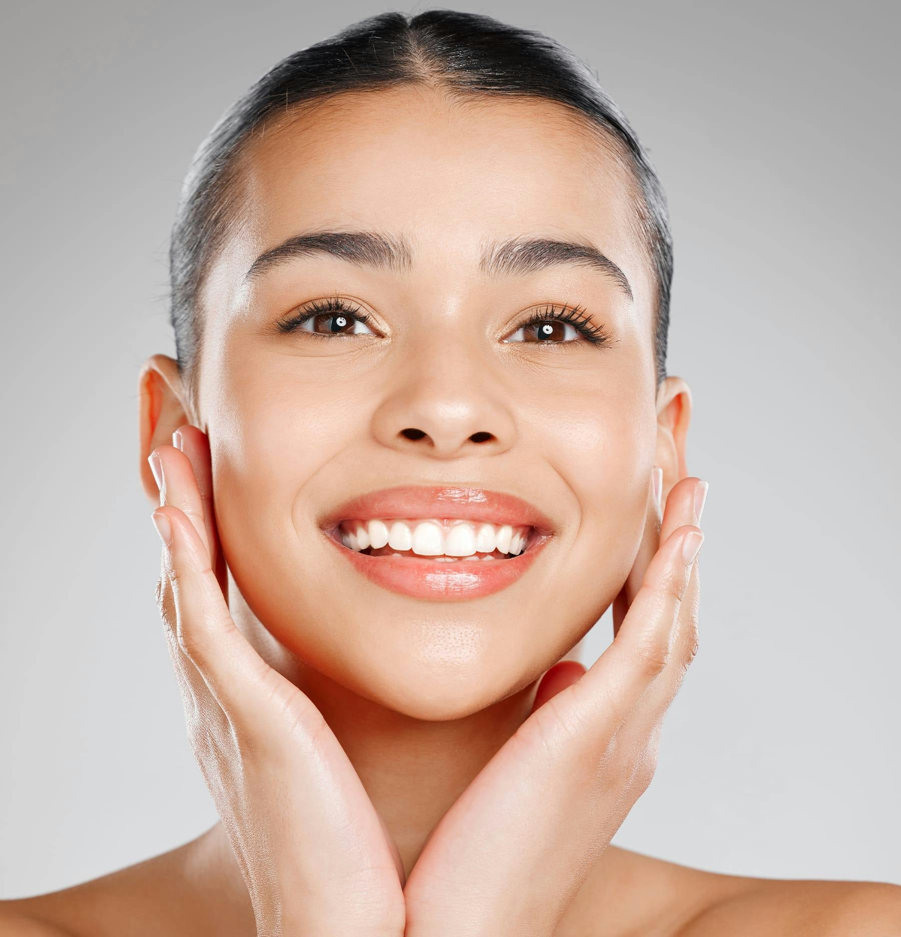 Woman Smiling with Hands on her Cheeks