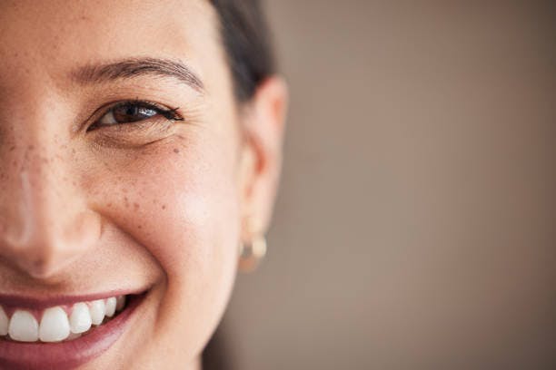 Half of Woman's Face Smiling