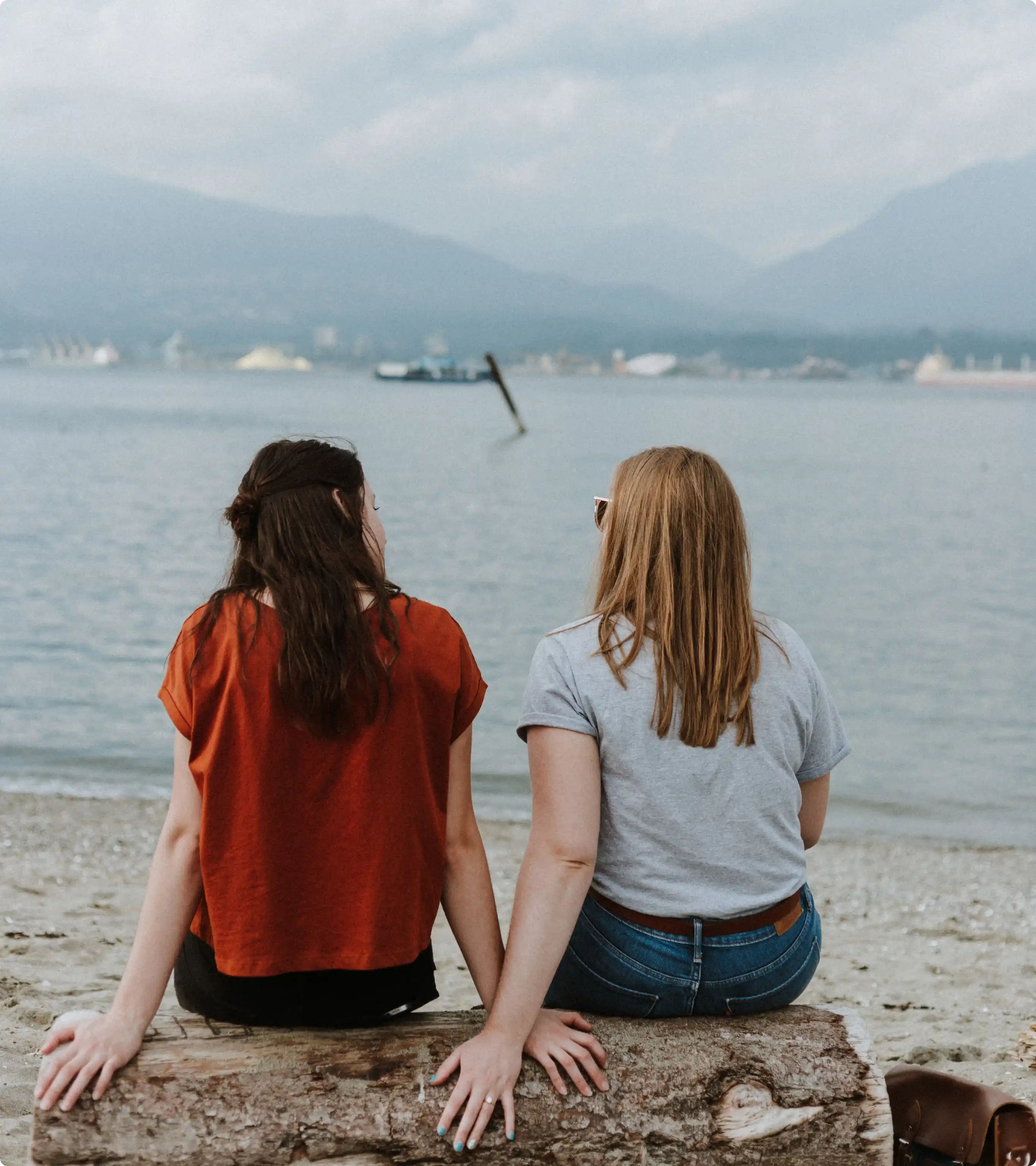 Two women holding hands.