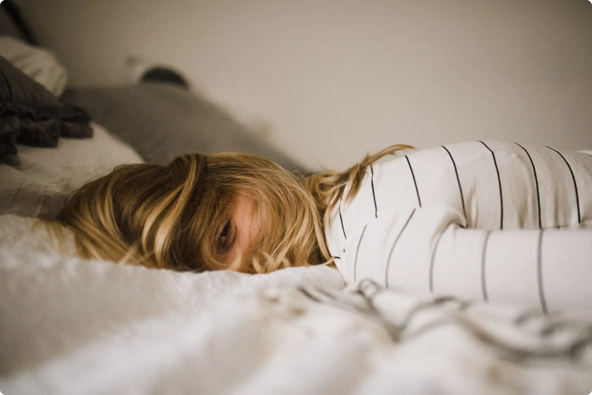 A woman sleeping in bed.