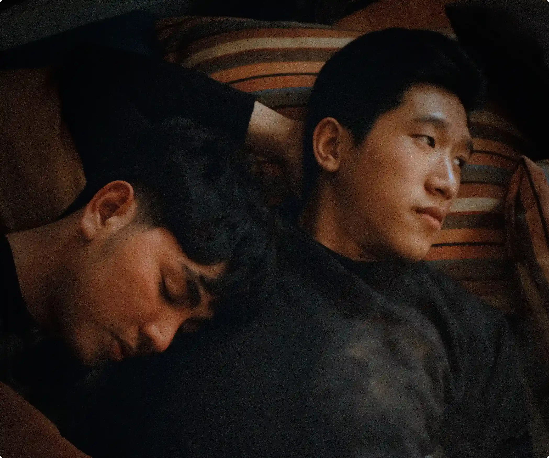 Two men sleeping.