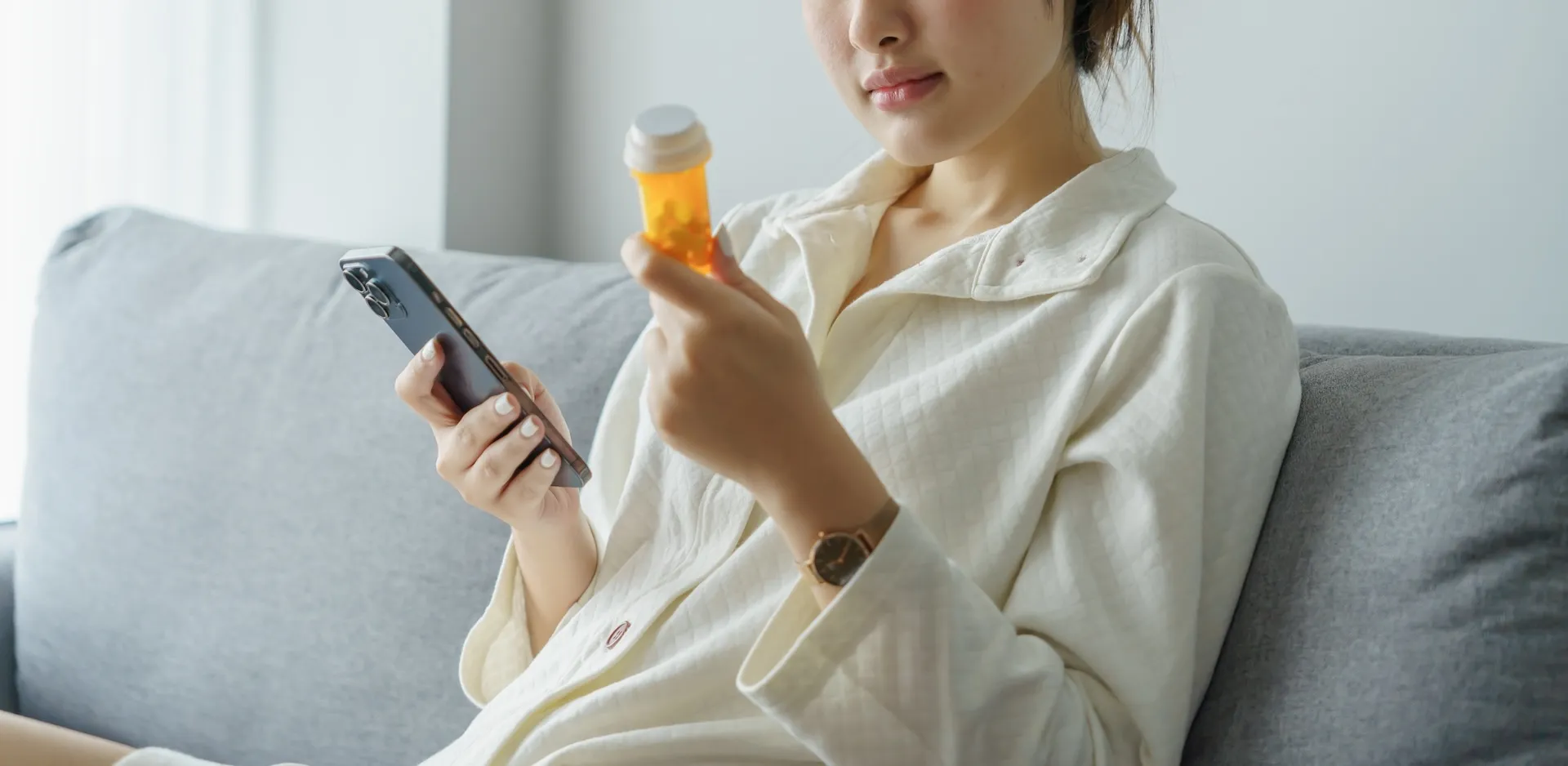 Woman with pill bottle