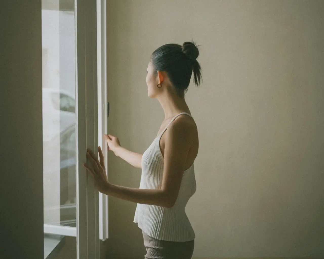 Woman looking out of a window