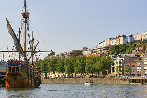 Bristol harbourside with the Matthew boat and colourful houses of Cliftonwood in the background