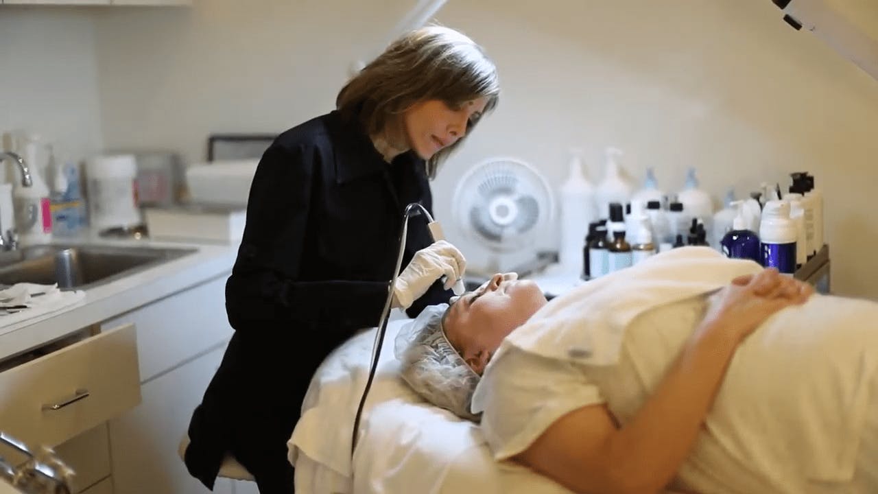 Aesthetician Performing a Facial