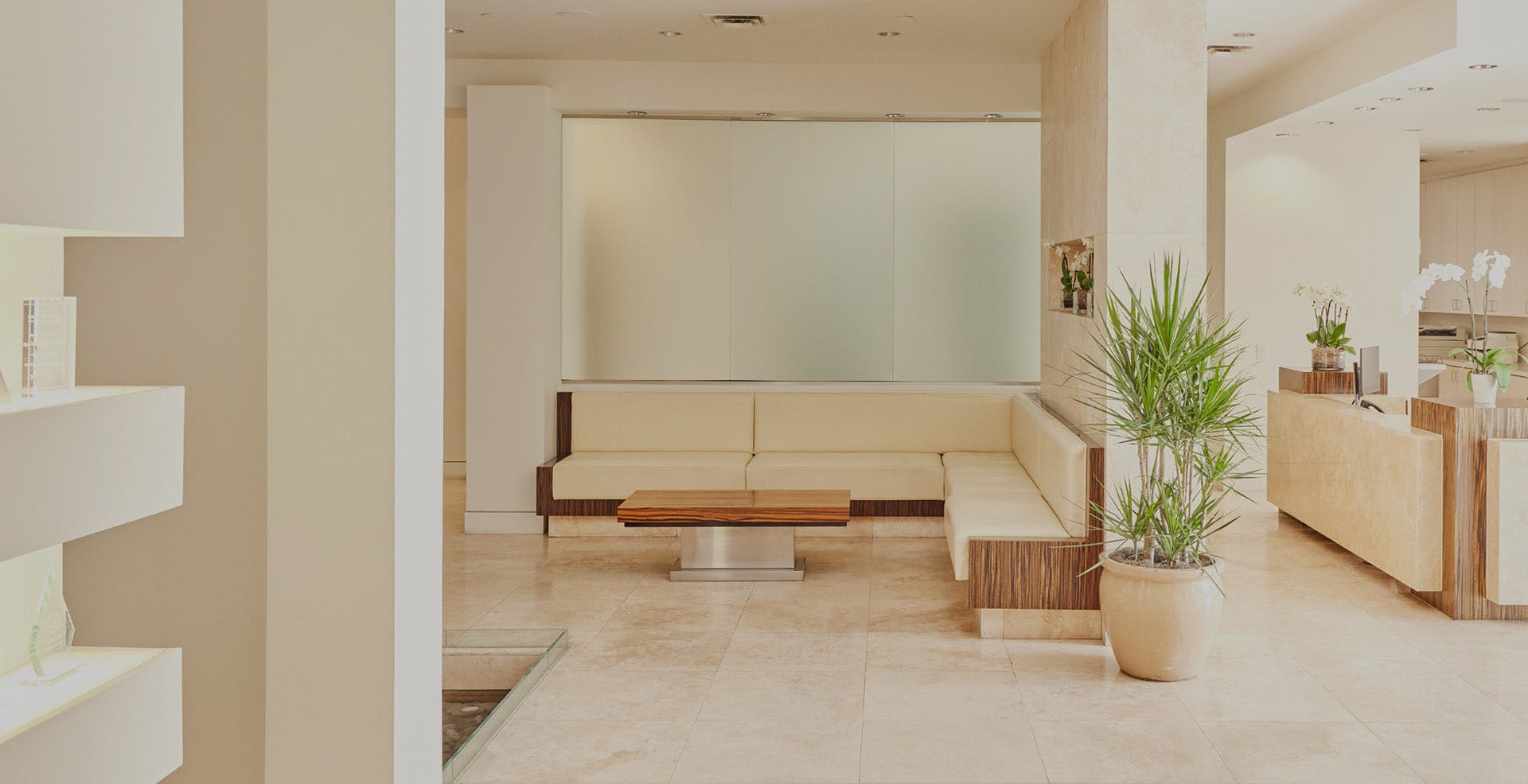 Wide shot of a mostly beige colored lobby