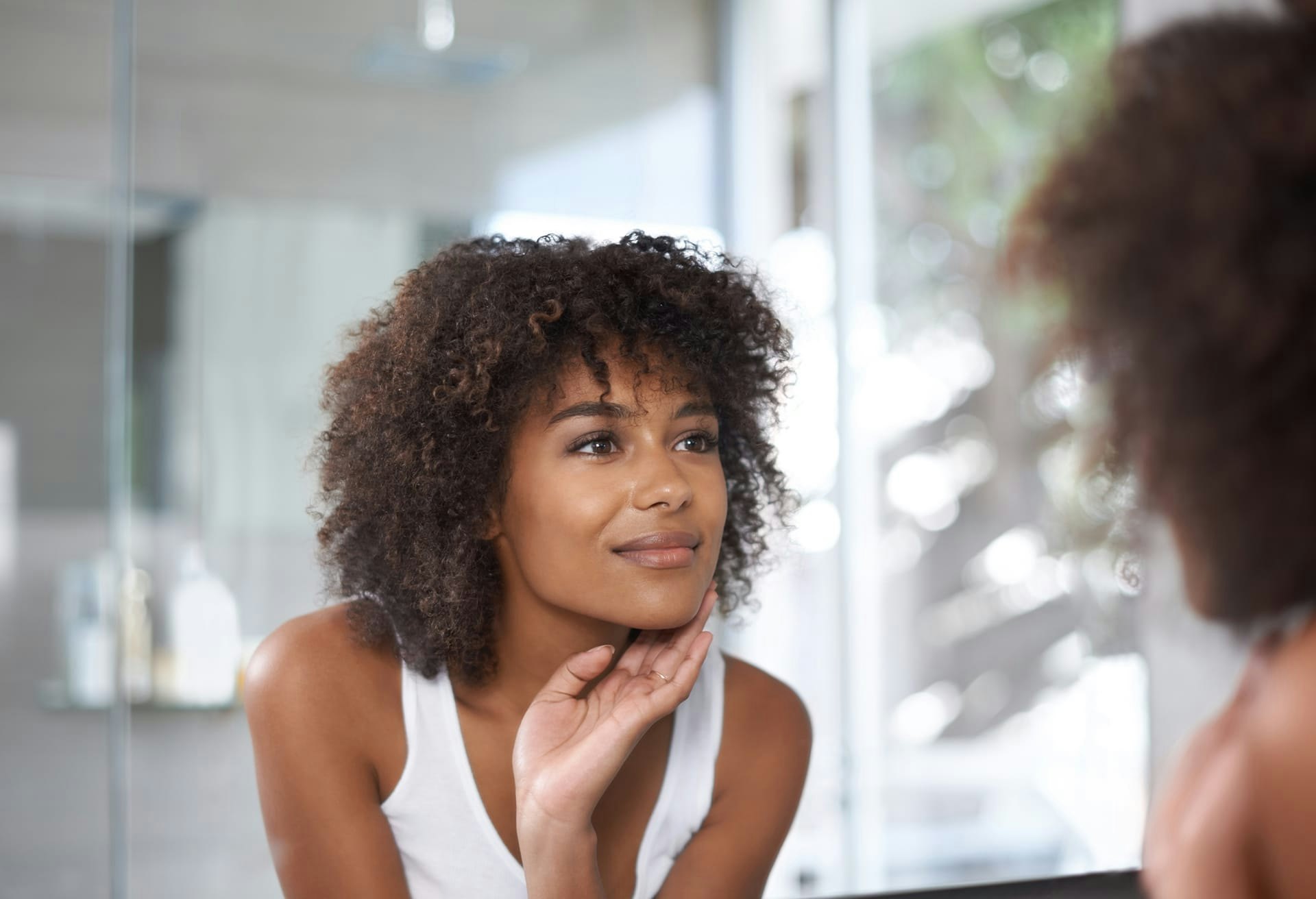 Woman Looking at Her Reflection