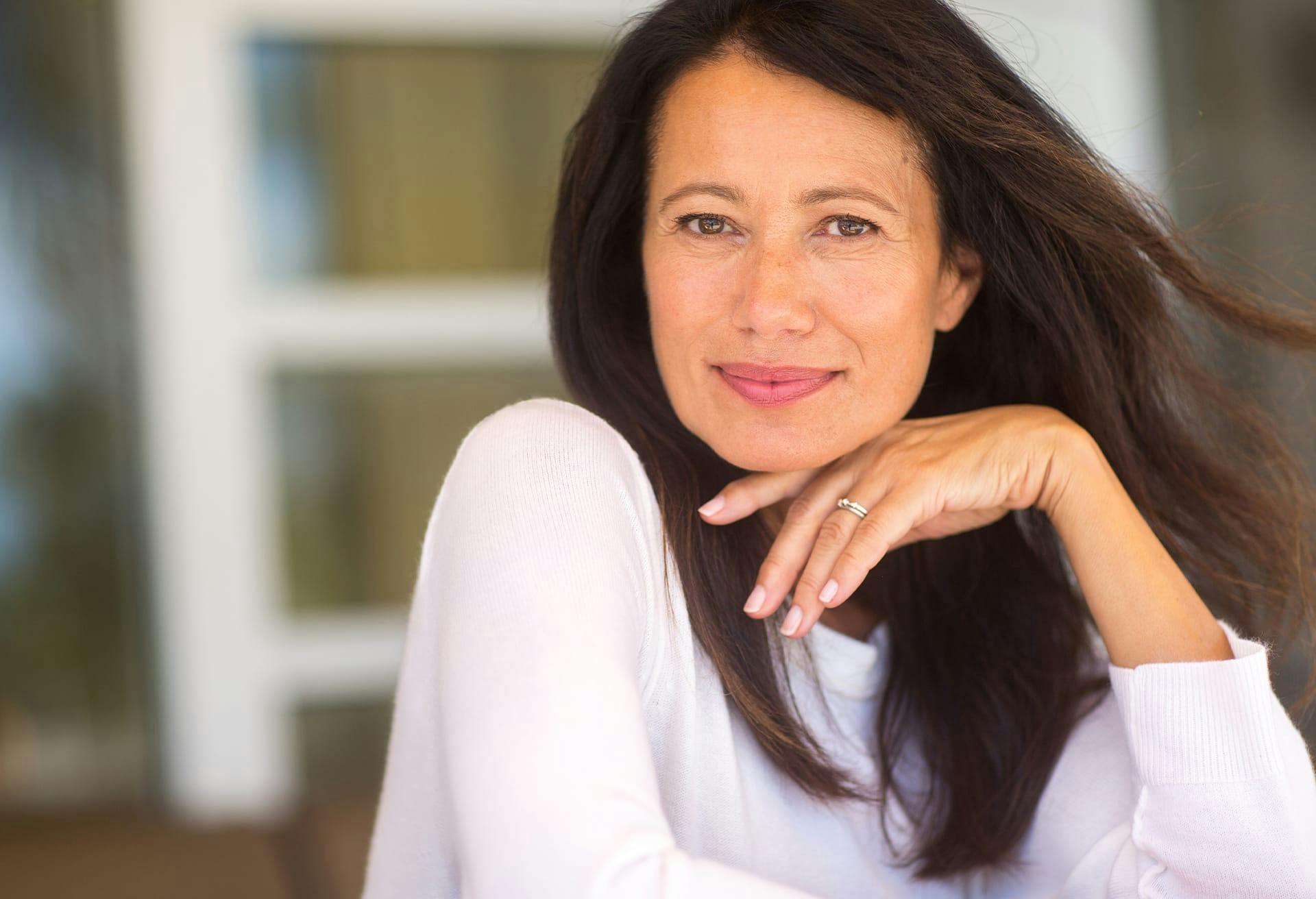 Woman with Dark Hair and a White Blouse