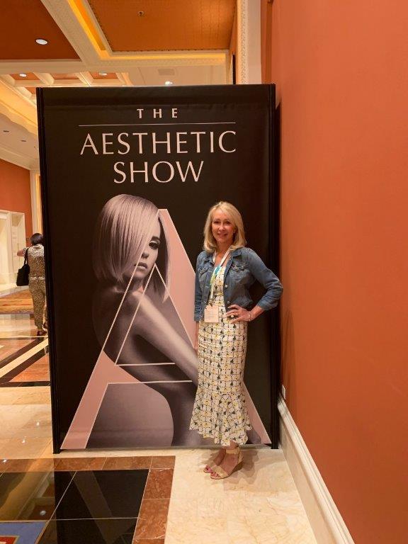 Woman Posing in Front of the Aesthetic Show Poster