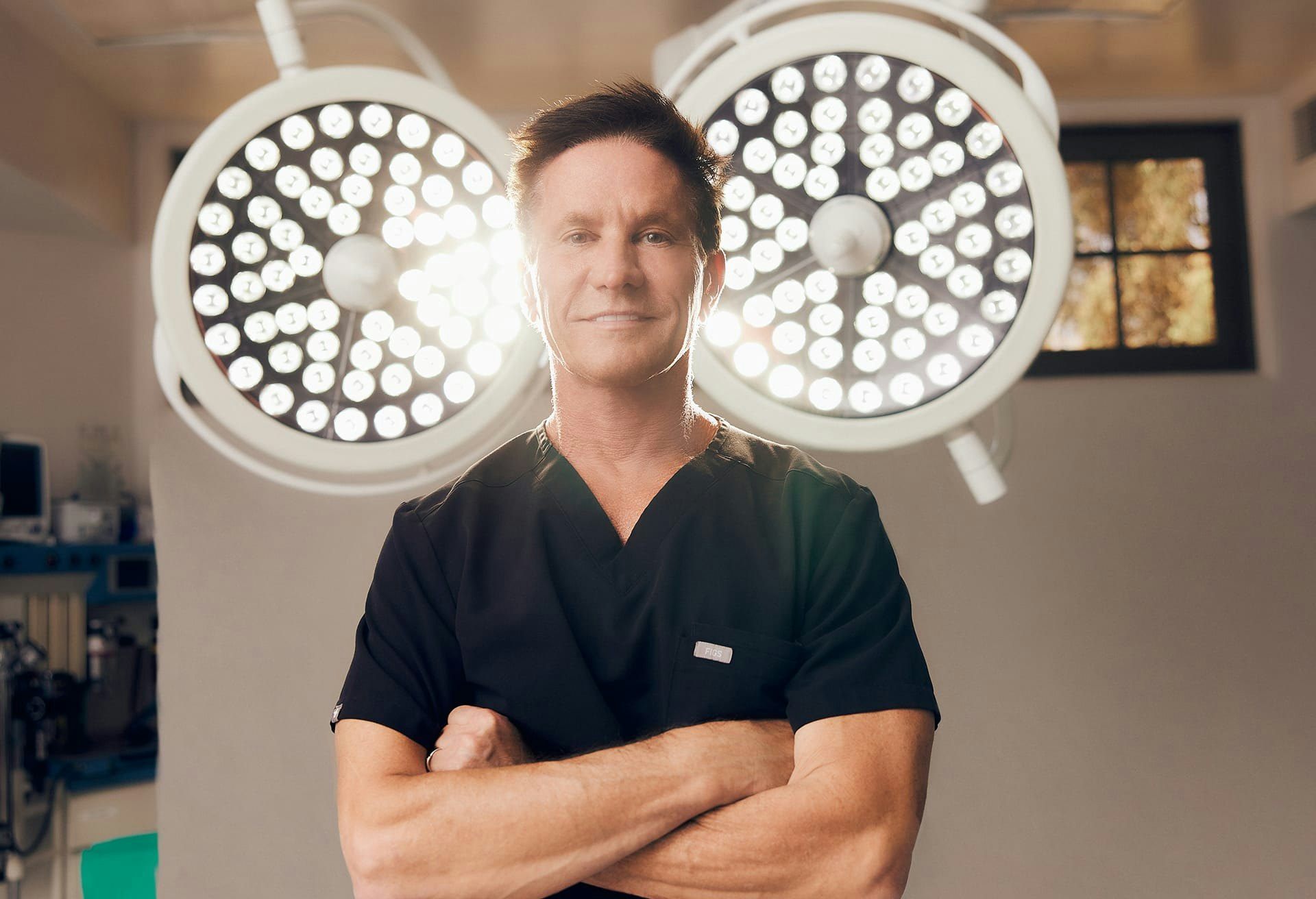 Dr. Shapiro Posing in Front of Surgical Lights