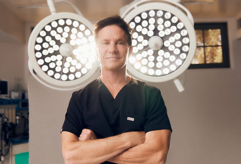 Dr. Shapiro Posing in Front of Surgical Lights