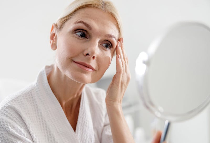 Woman Looking at Her Reflection