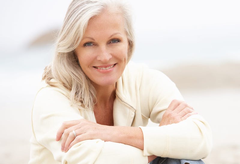 Older Woman Sitting with Her Arms Crossed