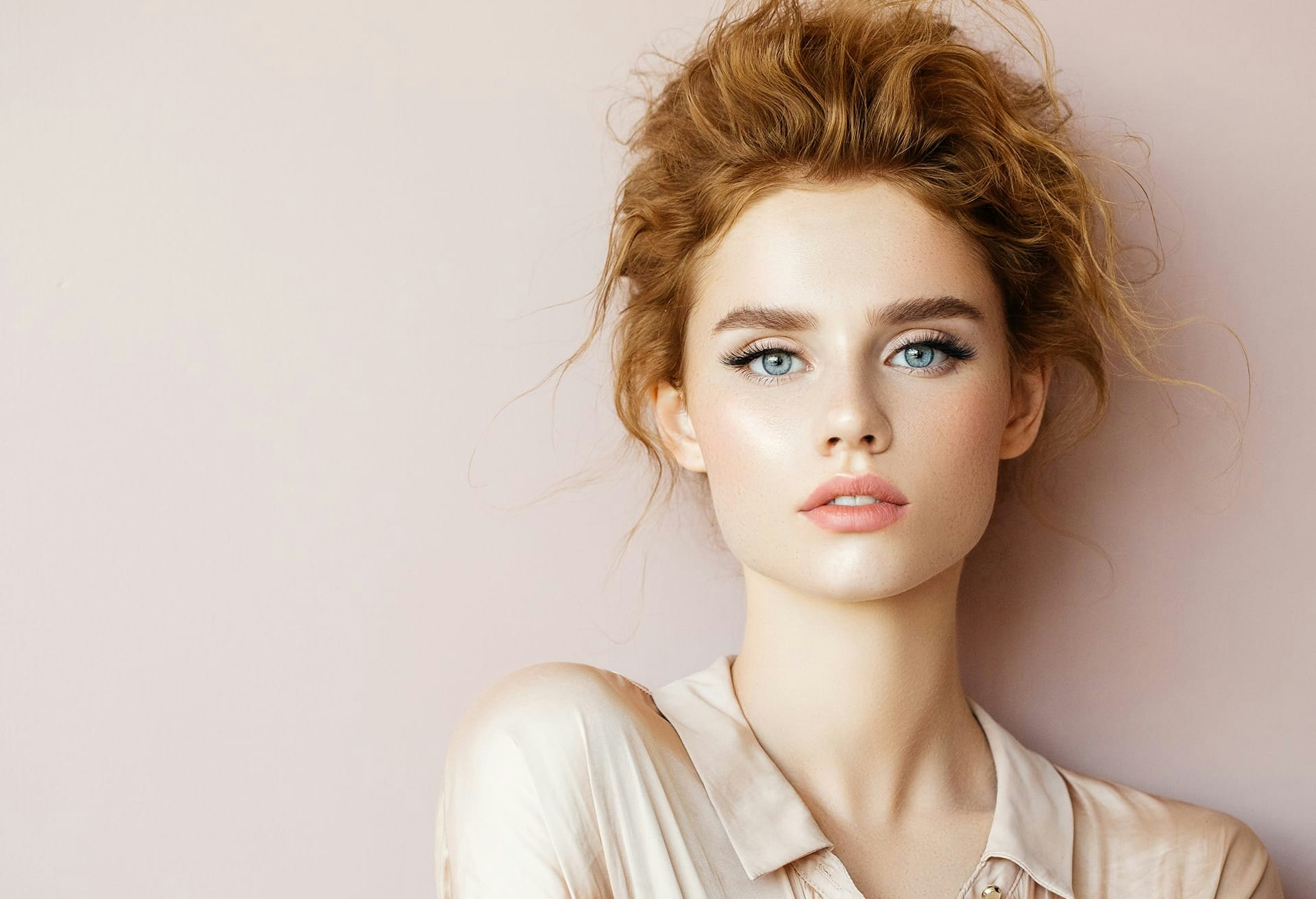Woman with Blue Eyes and Messy Hair
