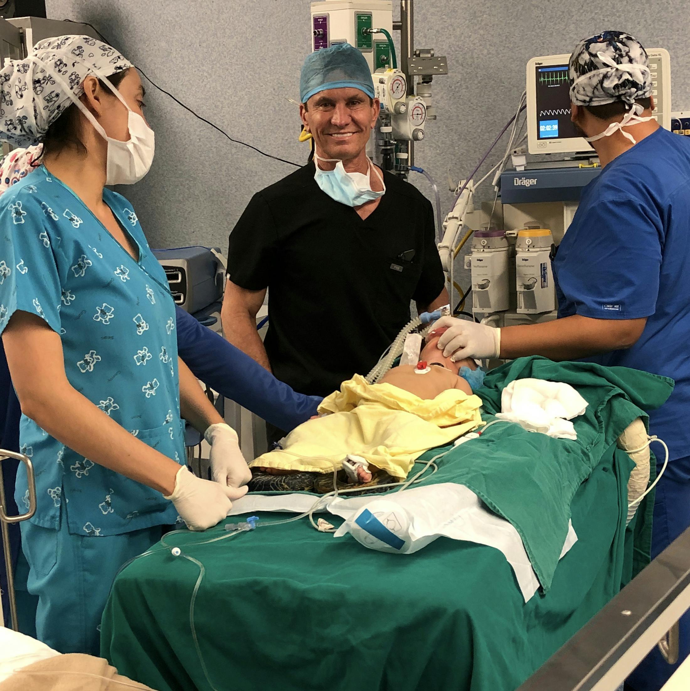 Dr. Shapiro Performing a Procedure on a Baby