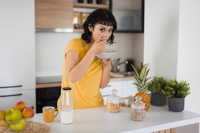Woman Eating Pineapple